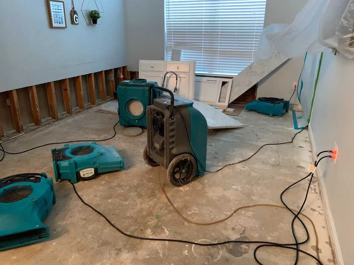 Dehumidifier in flood-cut room for Water Damage Restoration in Oakfield